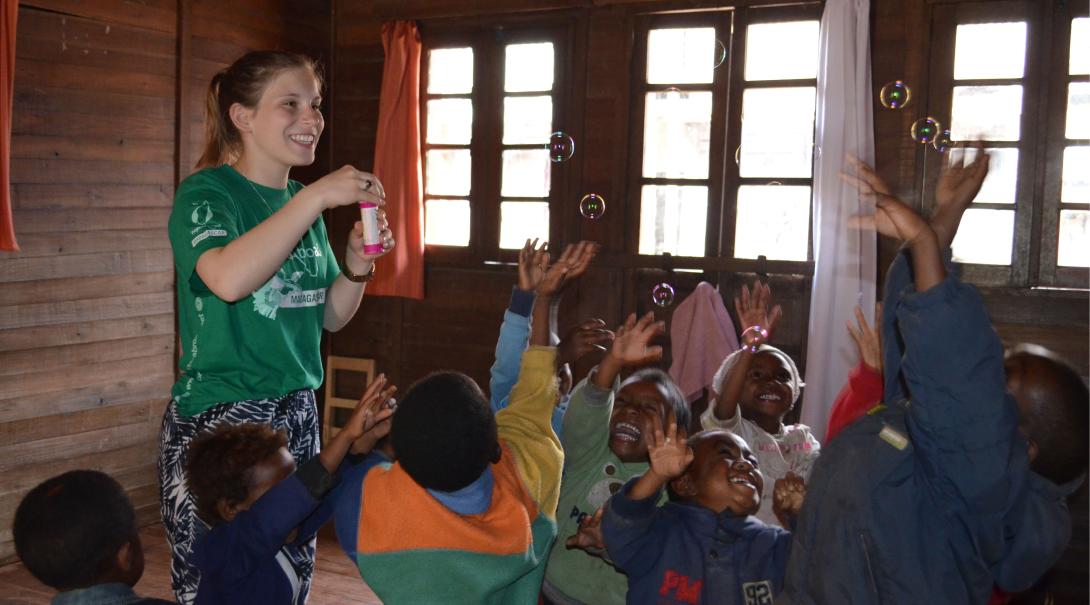 Fundraising is one way of financing your trip to Madagascar. A volunteer is having fun with children in Madagascar after she fundraised her trip to this African country.
